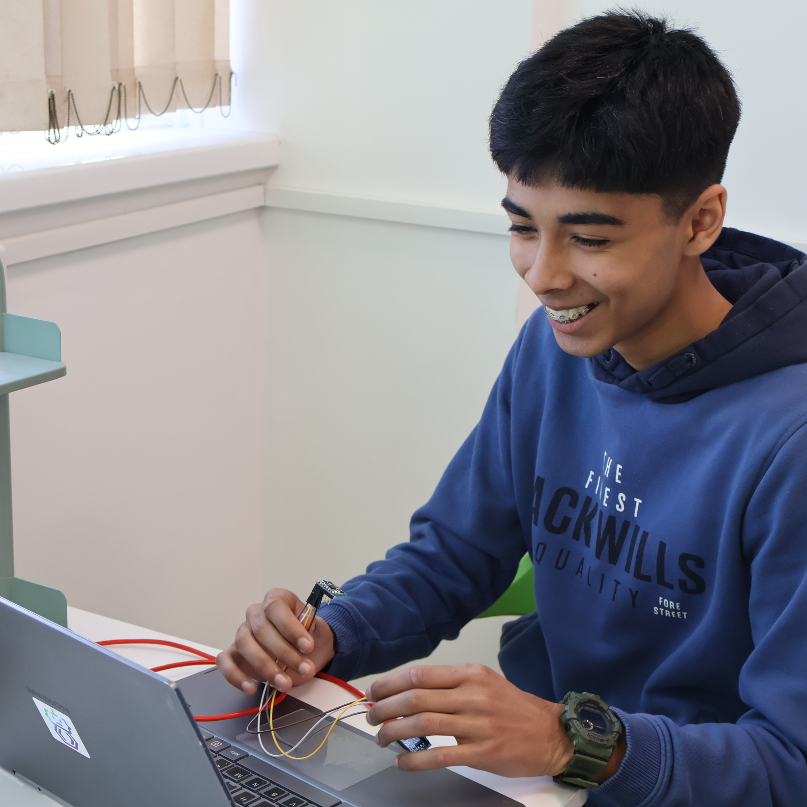 Student building a robot