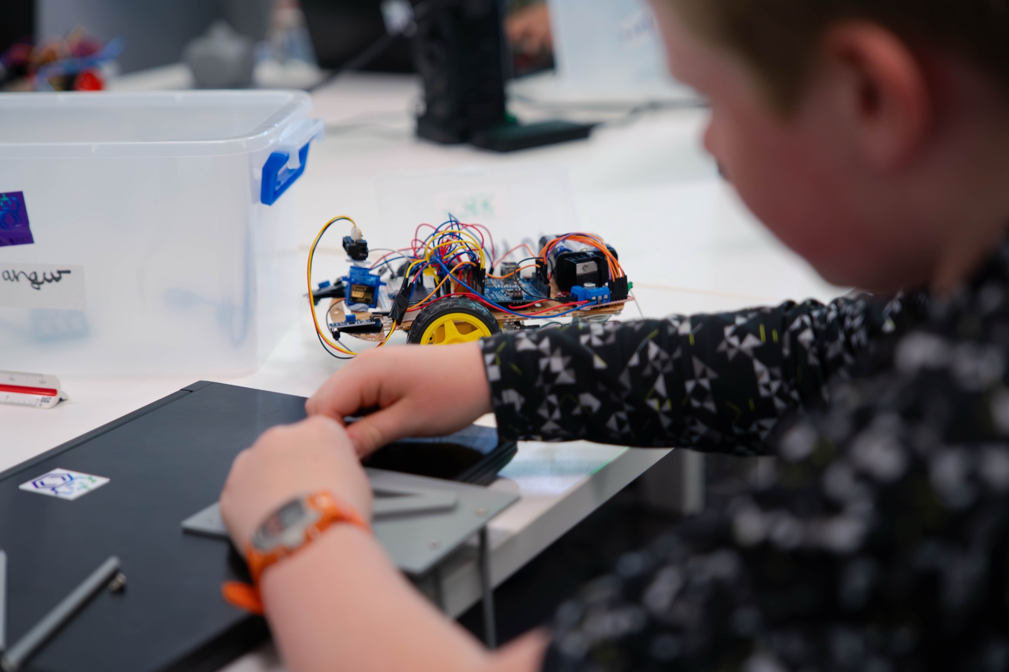 A Robocoder wiring an Arduino-driven robot car.
