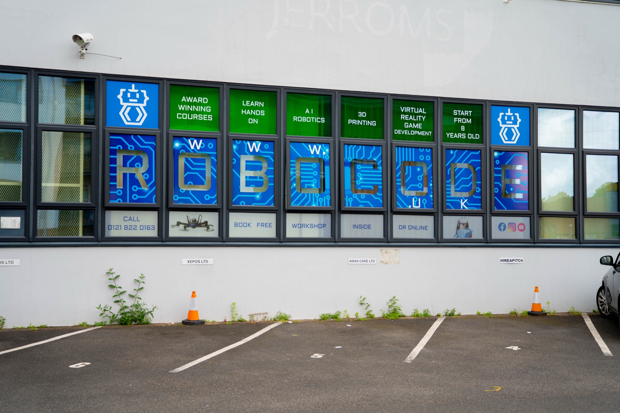 Robocode signage in the Shirley centre windows, circuit-board styled lettering.